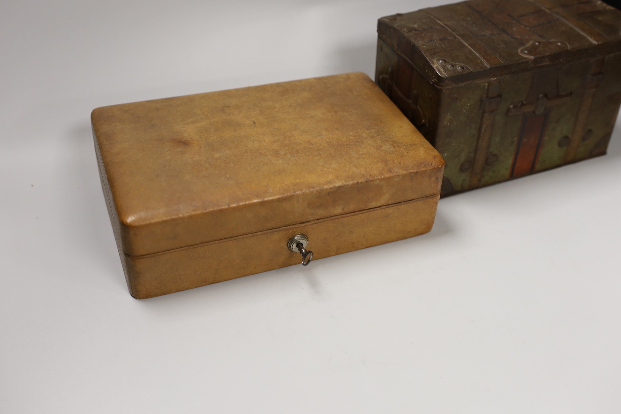 A leather Bramah jewellery case, a tortoiseshell cigarette box and a biscuit box. Widest 25.5cm